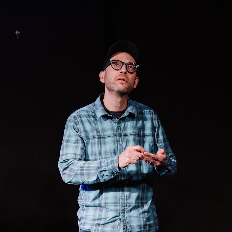 Erik Horn performing on stage at Northwest Improv Fest in Spokane