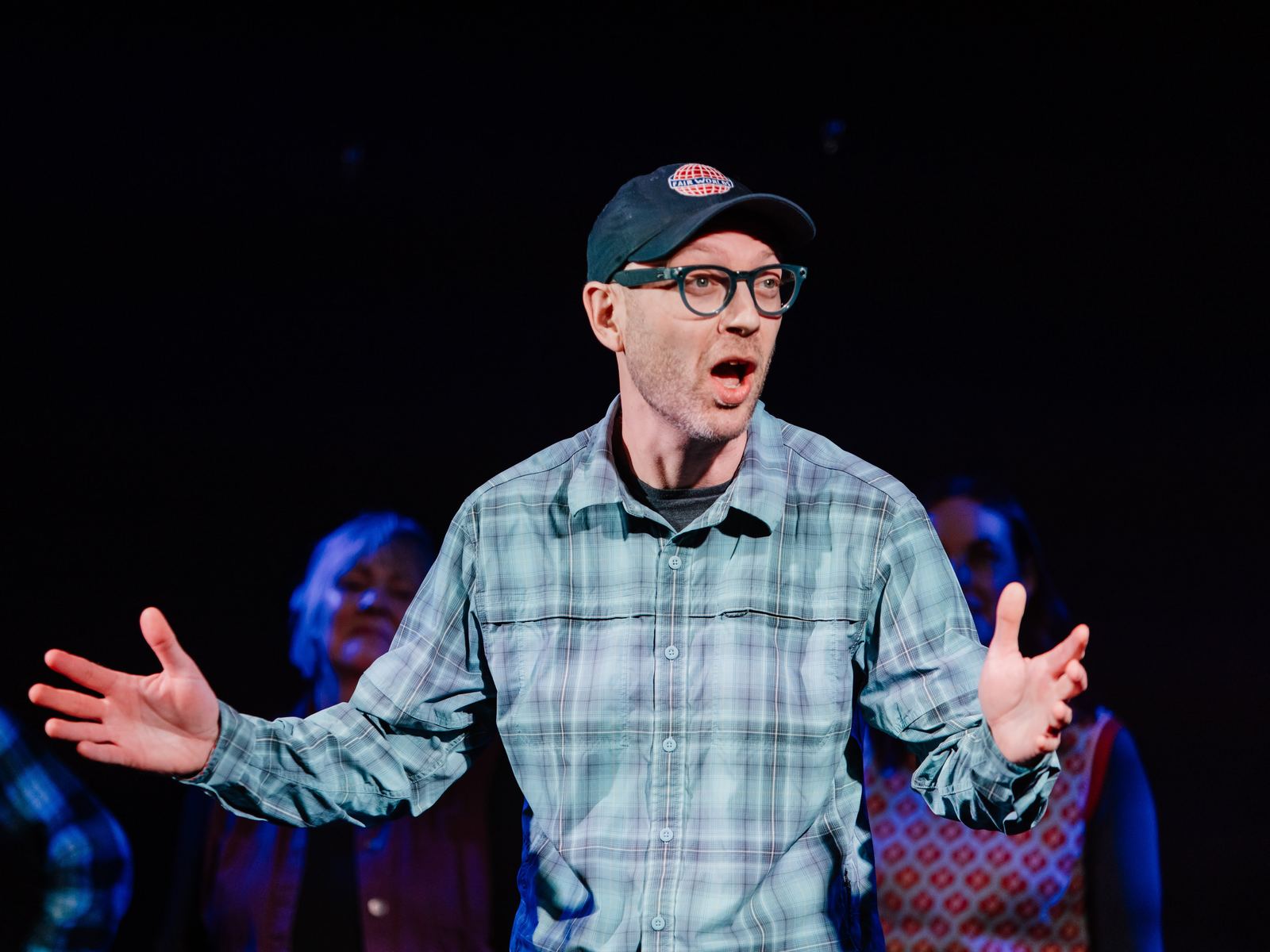 Erik with arms wide open, telling the audience what happened